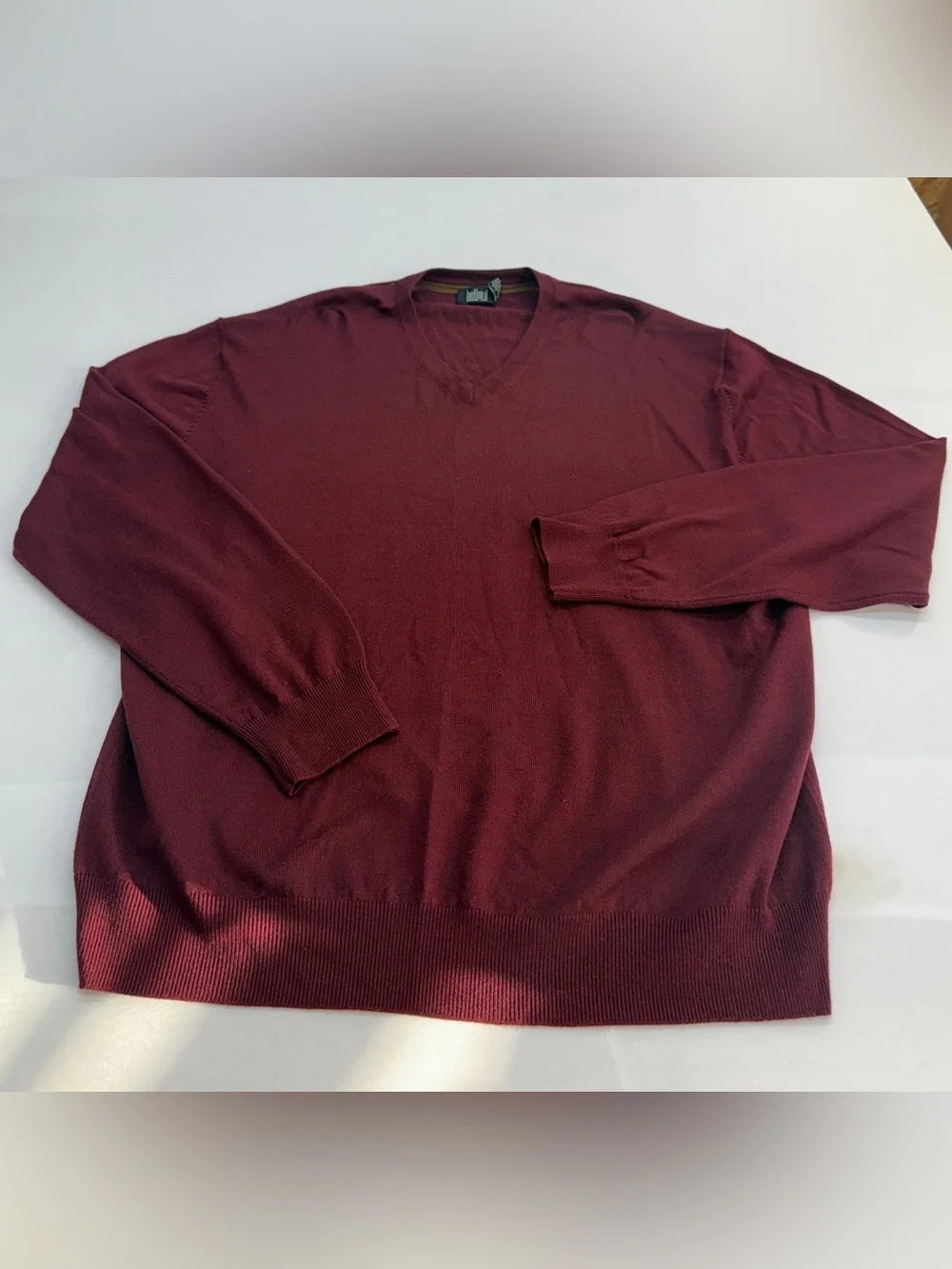 Men's V-Neck Sweater in Burgundy by Belford. Made of extra fine Merino Wool.